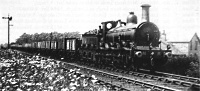 Two MR 0-6-0 tender engines double heading a wagon train & a MR 4-4-0 at Hellifield